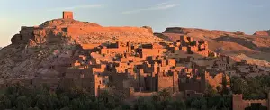 The ancient mud brick buildings of Kasbah Ait Benhaddou bathed in golden morning light