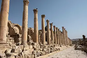 Jerash Prints: Ancient Roman road with a colonnade in the archaeological site of Jerash