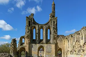 Crumbling Prints: Ancient ruins of a Gothic abbey under a clear blue sky at Byland Abbey