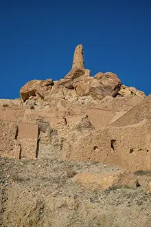 Relics Prints: Ancient ruins stand tall against clear sky in Shahr-e-Gholghola