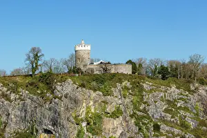 Bristol Prints: Ancient stone castle perched atop a rugged limestone hill under a clear blue sky in Bristol