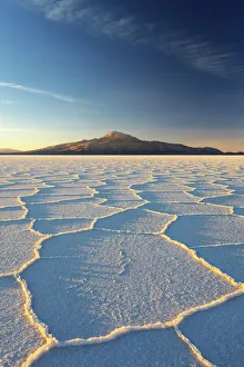 Images Dated 9th July 2009: An Andean volcano rises above the Salar de Uyuni, the incredible salt desert, during