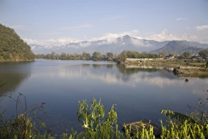 Annapurna range reflecting in Fewa (Phewa) Lake at dawn, Pokhara, Nepal, Asia Annapurna range reflecting in Fewa (Phewa) Lake at dawn, Pokhara, Nepal, Asia