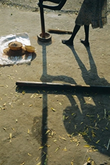 Preparation Prints: Anouak woman grinding corn using pestle and mortar, Deepa village, Lake Tata