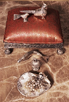 Small Number Of Objects Prints: Antique silverware on marble top table