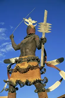Native American Prints: Apache Mountain Spirit Dancer, a 20ft bronze by Craig Dan Goseyun, San Carlos Apache