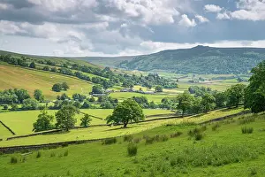 Appletreewick village and the River Wharfe with distant Simon's Seat in Wharfedale, The Yorkshire Dales, Yorkshire, England, United Kingdom, Europe