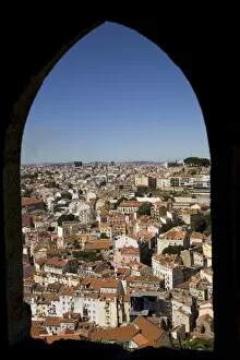 Images Dated 19th August 2009: An arched window at the Castelo Sao Jorge (Castle of St. George) provides a view of Lisbon