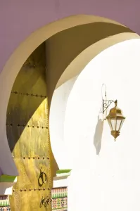 Typically Moroccan Prints: Archway, golden door and lantern at entrance to Mosque in the Kasbah, Marrakech, Morocco