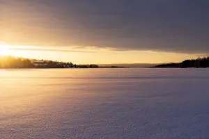 Harads Prints: Arctic sunrise over the frozen landscape covered with snow in winter