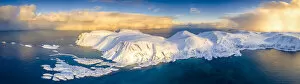 Arctic Gallery: Arctic sunrise on snow capped mountains and cold sea, aerial view, Sorvaer, Soroya Island