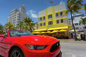Contrast Collection: Art Deco architecture and red sports car on Ocean Drive, South Beach, Miami Beach