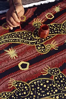 Artist Prints: Artist of the Walpiri tribe using a stick to make dream paintings, in Australia, Pacific