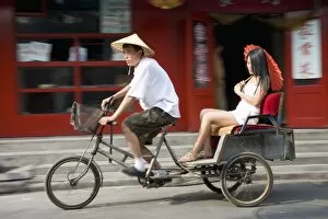 Images Dated 2nd September 2007: Asian woman (Chinese-Thai) in cycle rickshaw, Hutong District, Beijing, China, Asia