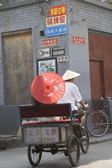 Rick Shaw Prints: Asian woman riding in cycle rickshaw, Hutong District, Beijing, China, Asia