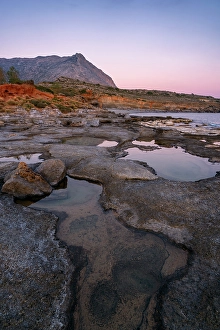 Azure Prints: Aspes beach, natural holes in the rocks full of water at sunset