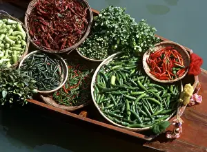 An assortment of chillies, a staple ingredient of Thai cooking, on sale on a boat in a floating market in Thailand, Southeast