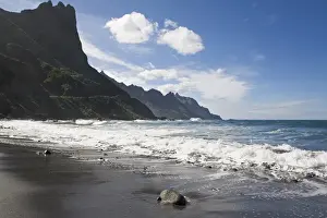 Volcanic Sand Prints: Atlantic Ocean waves crash onto black volcanic sand at Taganana, Tenerife