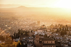 Granada Prints: Atmospheric hazy sunset over Albaicin, UNESCO, Granada, Andalucia, Spain