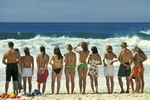 Attractive young people in swim wear lined up for a photo on Sydneys iconic Bondi Beach in the Eastern Suburbs, Bondi