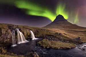 Aurora Borealis (Northern Lights) over Kirkjufell Mountian with a small waterfall in