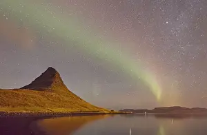 The Aurora Borealis (Northern Lights) seen in the night sky above Grundarfjordur