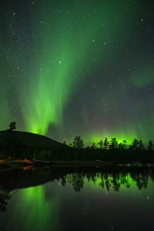 Muonio Prints: Aurora Borealis and stars over lake at night, Muonio, Lapland, Finland, Scandinavia