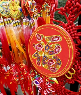 Bright Colour Prints: Auspicious Chinese word fu (good fortune) embroidered on a Chinese New Year ornamental souvenir