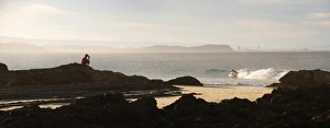 Queens Land Prints: Australian man watching surfers at Tweed Heads, Gold Coast, Queensland, Australia, Pacific