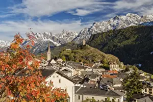 Lower Engadine Prints: Autumn colors frame the village of Ardez surrounded by woods and snowy peaks, Engadine