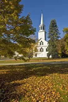 Autumn fall colours around traditional white timber clapperboard church