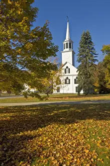 Autumnal Leaves Prints: Autumn fall colours around traditional white timber clapperboard church
