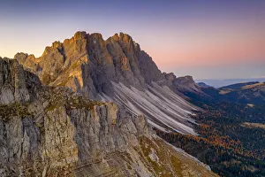 Autumn trees at feet of Furchetta and Sass Rigais, aerial view, Puez-Odle, Funes Valley
