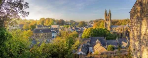Visiting Prints: Autumn view of St John the Baptist Church in Tideswell with surrounding landscape in Derbyshire Peak District