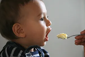 Images Dated 25th September 2006: Baby feeding, France, Europe