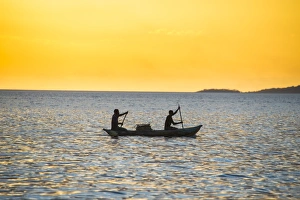 Fishermen Prints: Backlight of fishermen in a little fishing boat at sunset, Lake Malawi, Cape Maclear