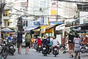 Saigon Prints: Backpackers on city street, Ho Chi Minh City (Saigon), Vietnam, Indochina, Southeast Asia