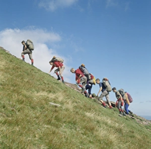 Images Dated 12th February 2008: Backpackers scrambling, Pen y Fan, Brecon Beacons, Powys, Wales, United Kingdom, Europe