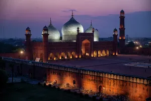 Nighttime Prints: Badshahi Mosque stands illuminated at night with lights showcasing its architecture and beauty in Lahore