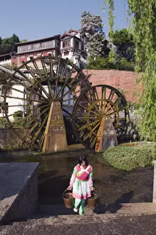 Water Mill Prints: A Bai girl carrying buckets of water in front of a water wheel in Lijiang Old Town
