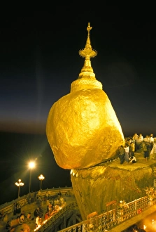 Balanced rock covered in gold leaf, major Buddhist stupa and pilgrim site