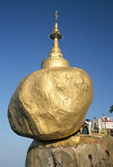 Balanced rock covered in gold leaf, major Buddhist stupa and pilgrim site