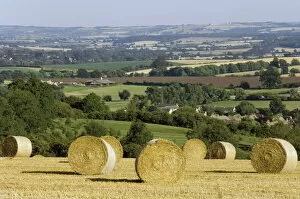 Farming Collection: Bales of hay with Chipping Campden beyond, from the Cotswolds Way footpath