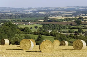 Harvest Prints: Bales of hay with Chipping Campden beyond, from the Cotswolds Way footpath