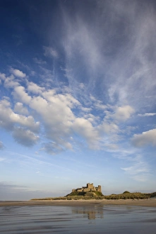 Images Dated 26th April 2009: Bamburgh Castle bathed in evening light, viewed from Bamburgh Beach, Bamburgh