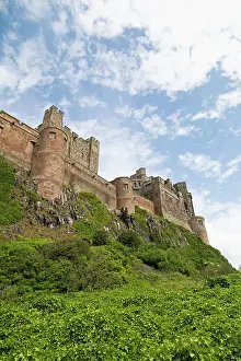 Northumberland Prints: Bamburgh Castle, a hilltop fortress constructed on top of a craggy outcrop of volcanic dolerite