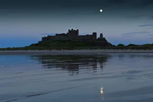 Protection Prints: Bamburgh Castle under a full moon at dusk in summer