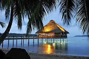 Dinner Prints: Bar and restaurant on stilts at dusk