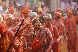 Barsana villagers celebrating Holi in Nandgaon, taunting Nandgaon villagers who throw