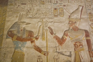 Bas-relief of the God Anubis on left and Ramses II on right, Temple of Seti I, Abydos